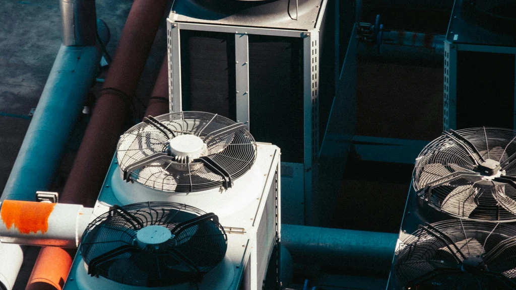 Illustrative rooftop cooling units and fans, not a McGill’s installation