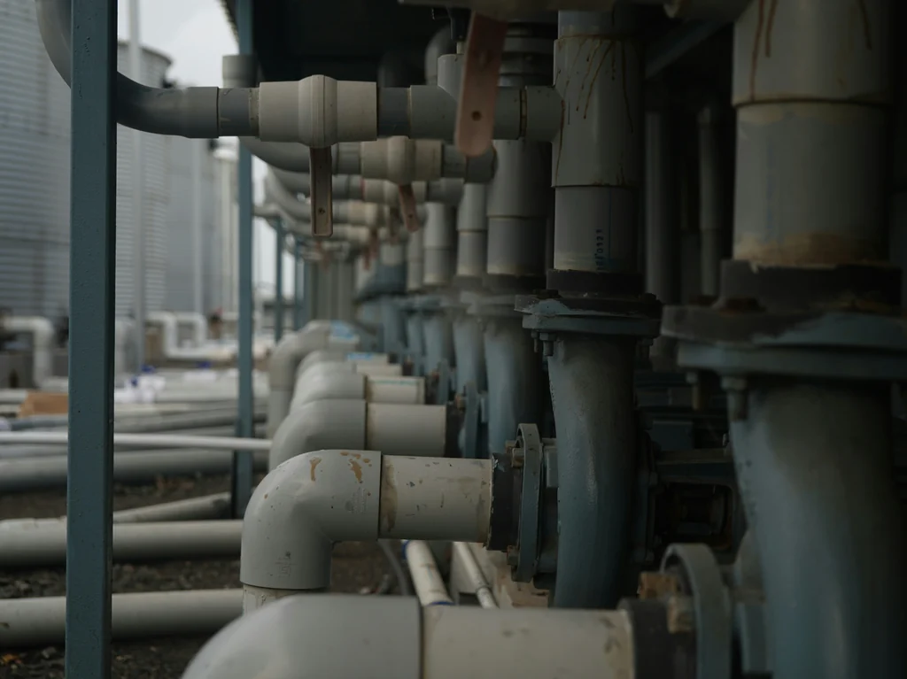 Illustrative industrial pipes and valves, not a McGill’s installation